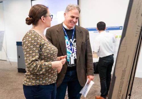 Nicole Everitt Explains Her Research Into Quantum Mechanics to UNT Dallas Interim President Dr. Warren von Eschenbach