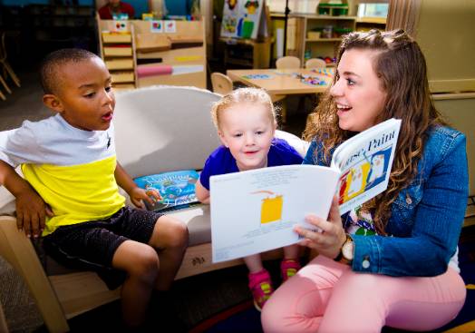 A Teacher Engages with Pre-K Students Through UNT Dallas' Child Development and Family Studies Program
