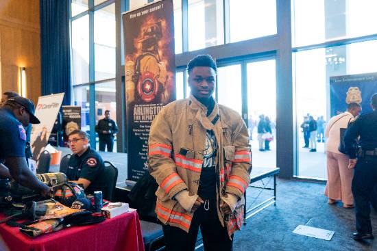 student wearing firefighter gear