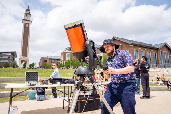 UNT Dallas STEM Center Manager Ian Grey Adjusts Equipment in Preparation for the April 8, 2024, Eclipse 