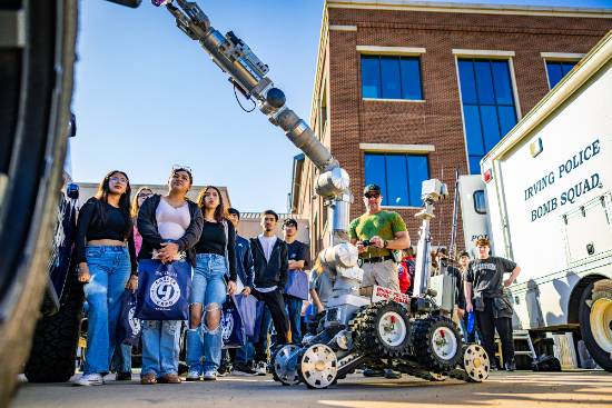 A Bomb Squad Technician Shows Students How a Remote-Controlled Robot Analyzes an Explosive Device