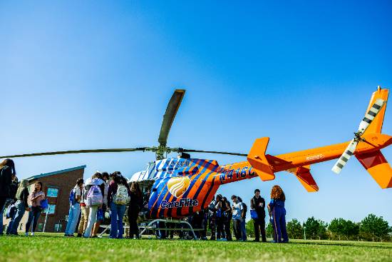 Students Gather Around a CareFlite Medical Helicopter - a Flying Ambulance - at the 2024 Criminal Justice & Public Safety Expo